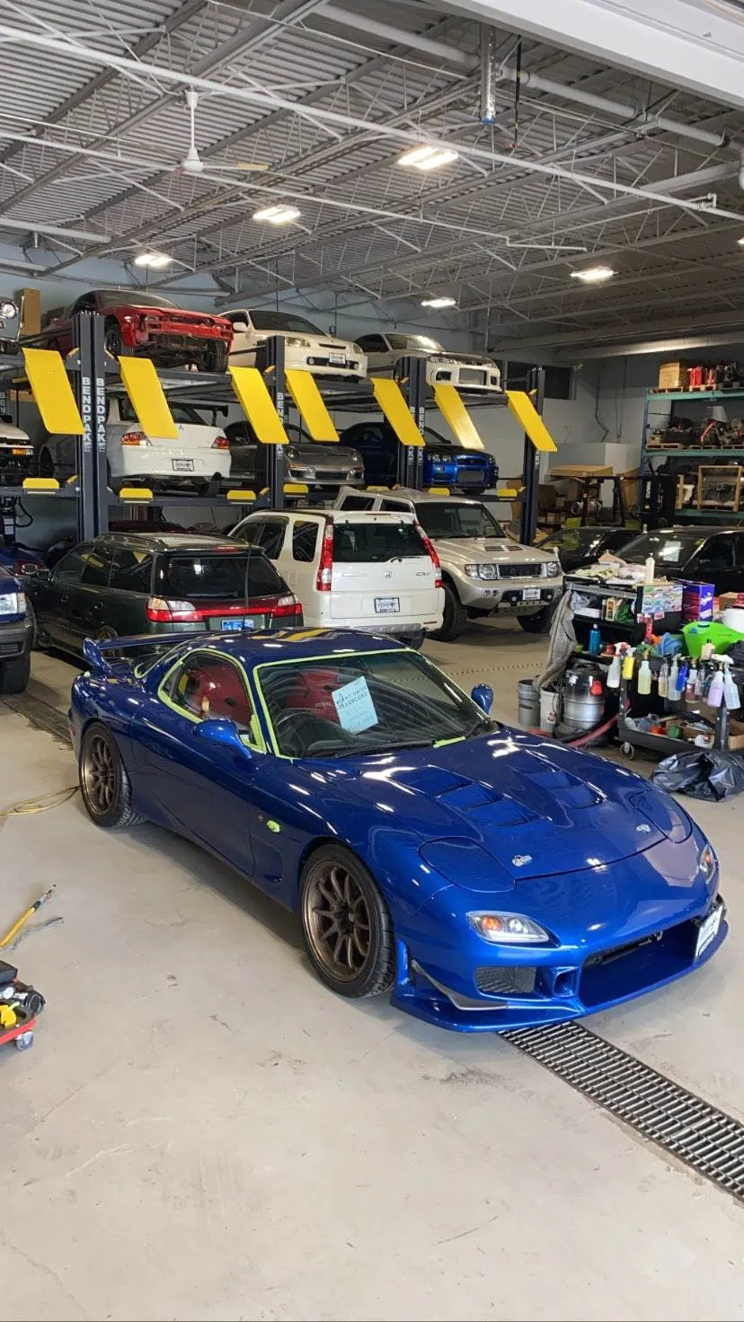 Blue Mazda RX-7 in the shop